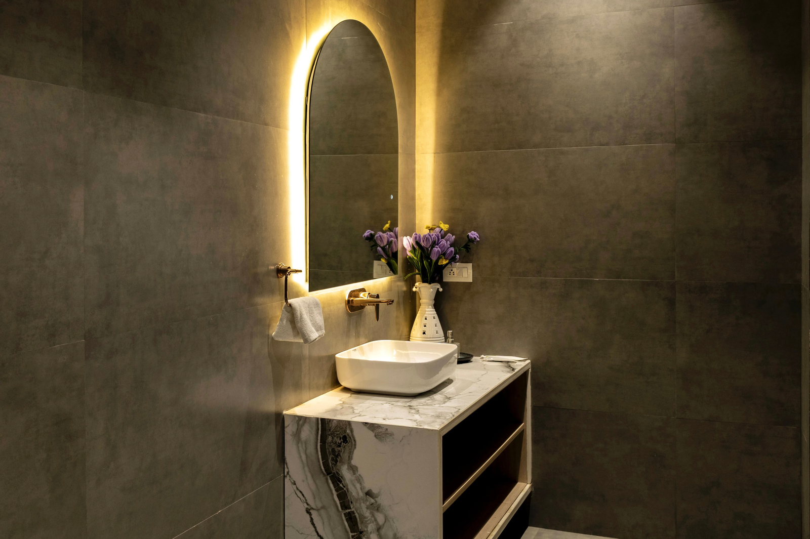 Nighttime view of the villa exterior with lights